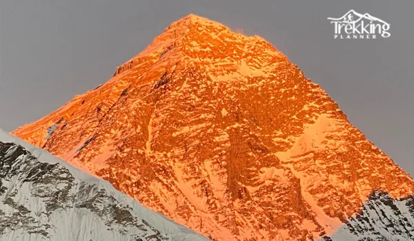 Everest Base Camp trek in April featuring snow-capped peaks and vibrant spring scenery.