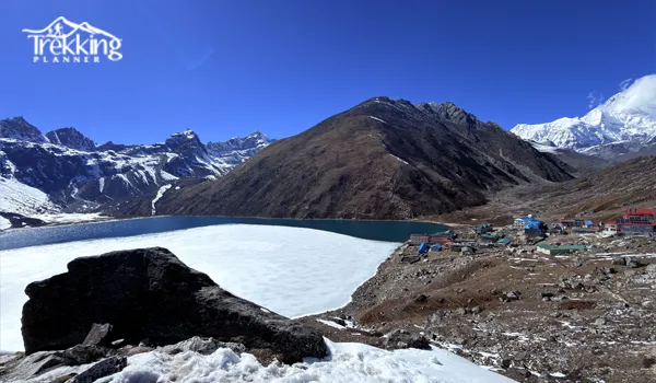 Trekkers exploring the majestic Gokyo Valley Trek with turquoise Gokyo Lakes and Himalayan peaks in Nepal.