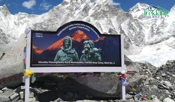Iconic Everest Base Camp rock partially covered by the new commemorative banner in Nepal.