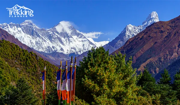 Trekker viewing Mount Everest and snow peaks from Namche viewpoint trekking trail