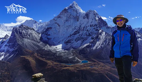 Senior trekkers enjoying the Everest Base Camp trek with panoramic Himalayan mountain views.