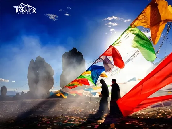Himalayan multi-country tour showcasing Nepal, Bhutan and Tibet mountain landscapes with snowy peaks and prayer flags