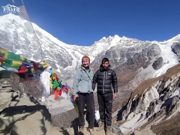 Trekking trail through Langtang Valley with Himalayan mountains and green hills in Nepal