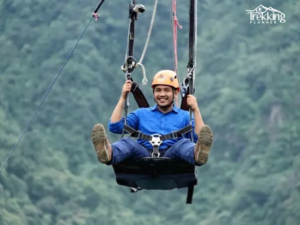 High-speed zipline adventure over forested hills in Pokhara Nepal