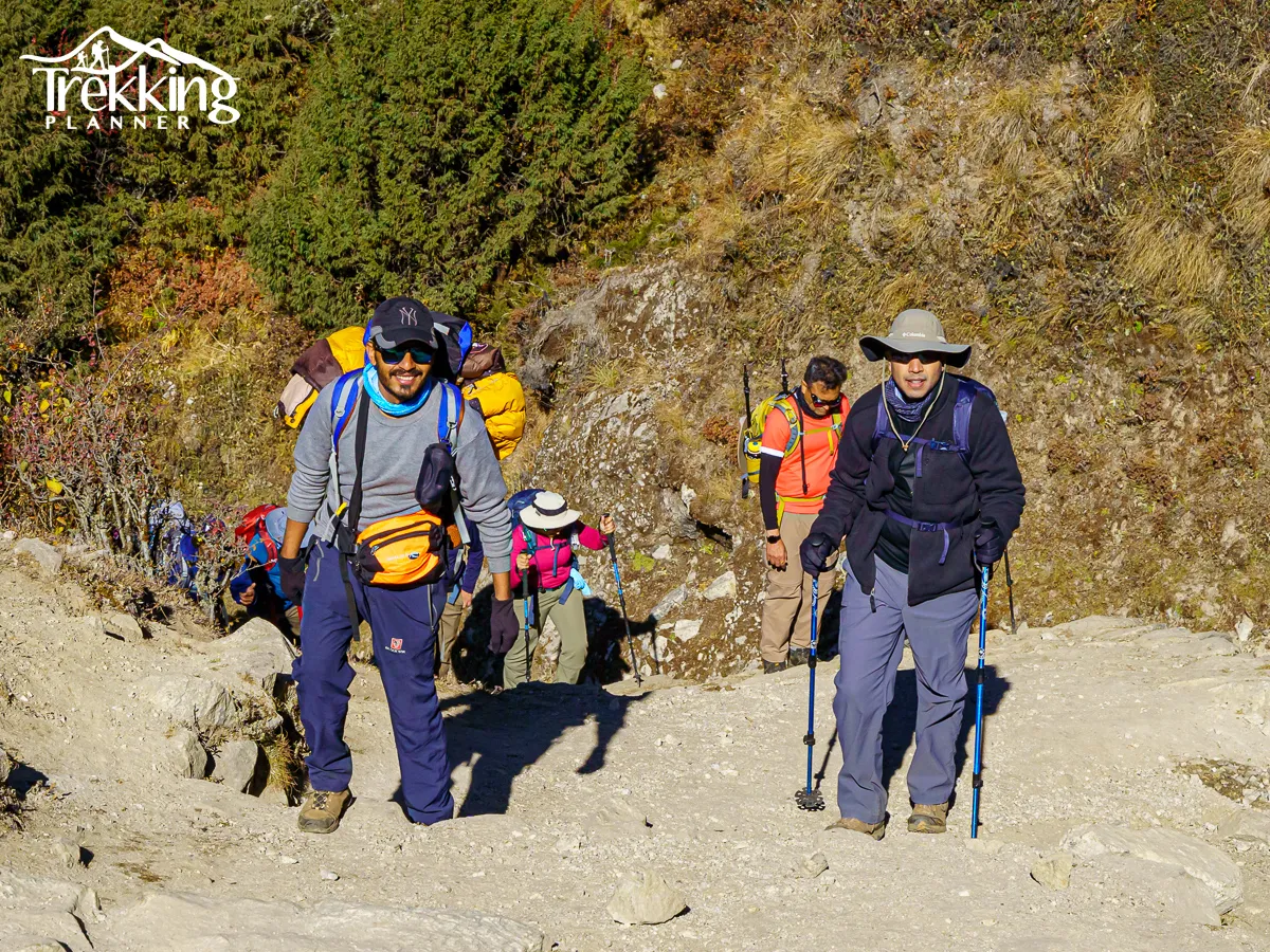 Mountaineers climbing steep icy rock face on Ama Dablam expedition route