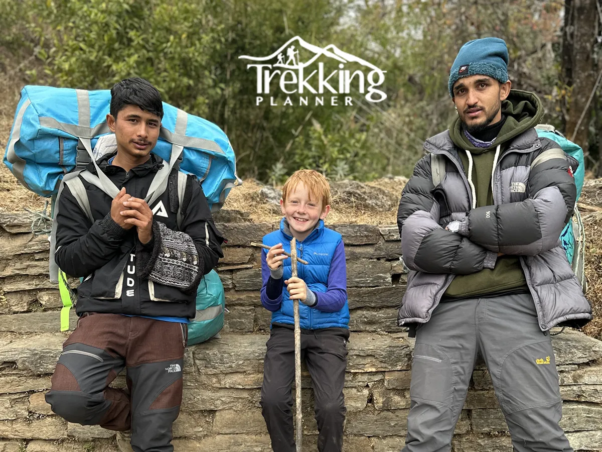Parents and children resting during a family trek in a mountain village on the Annapurna trail