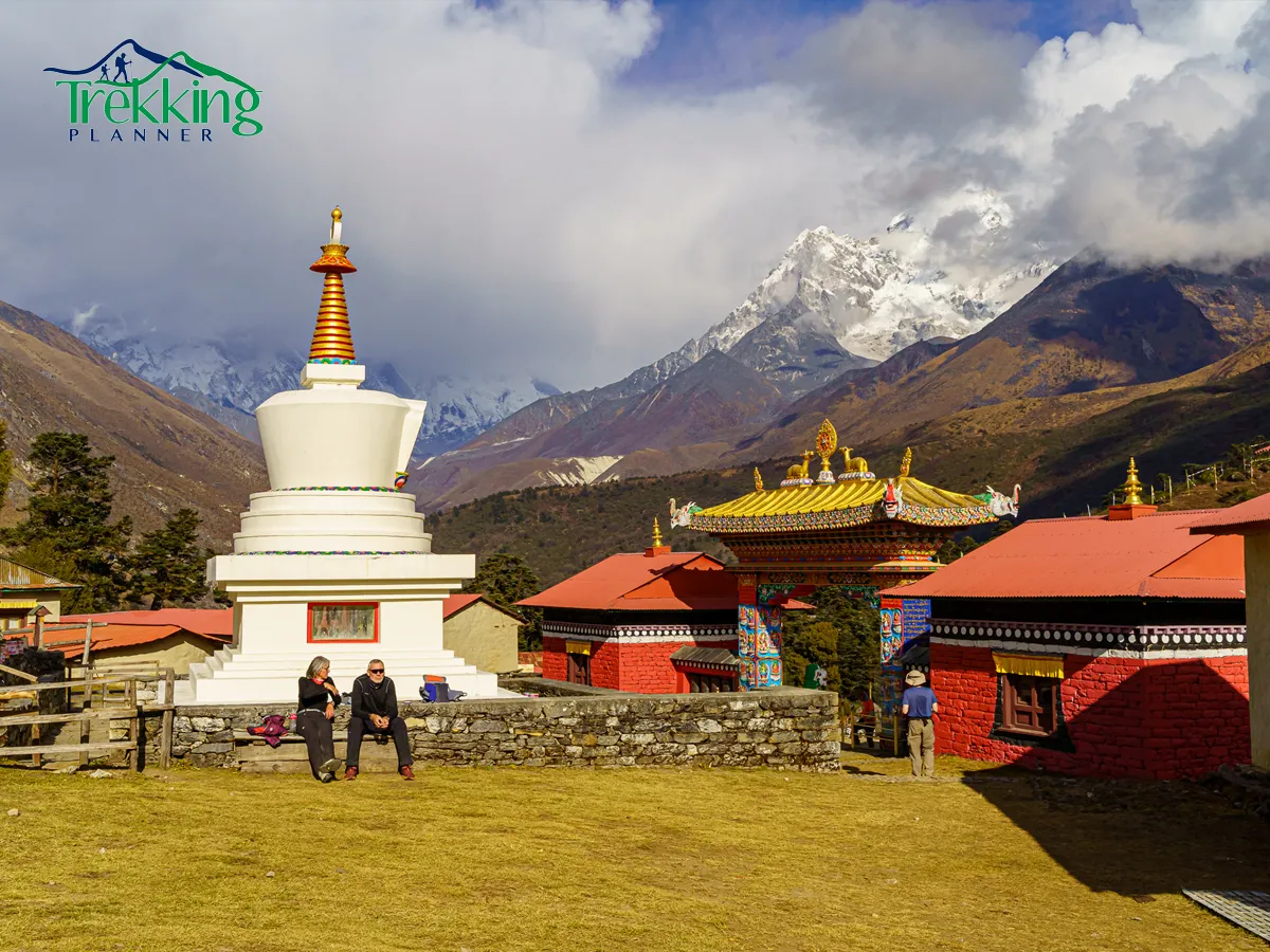 Traditional Himalayan village and prayer flags along Everest Panorama Yoga Trek route with yoga travelers