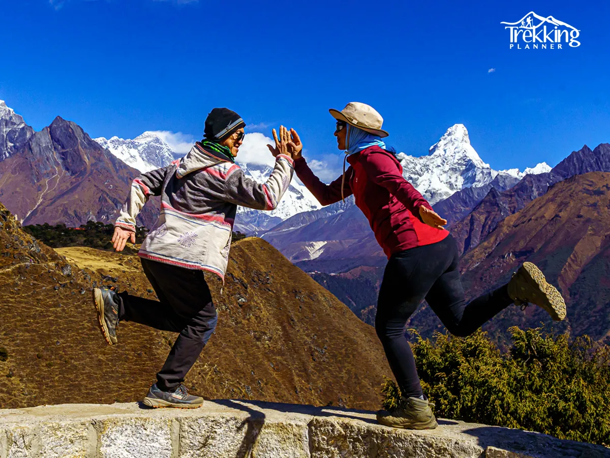 Yoga practice at sunrise with panoramic view of Mount Everest and Himalayan peaks during Everest Panorama Yoga Trek