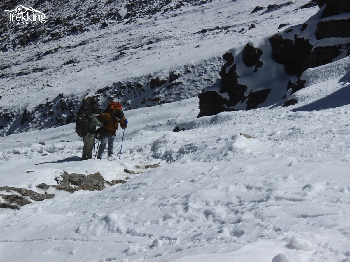 Hikers trekking near Everest Base Camp and tourists on a canoe safari in Chitwan National Park, Nepal.