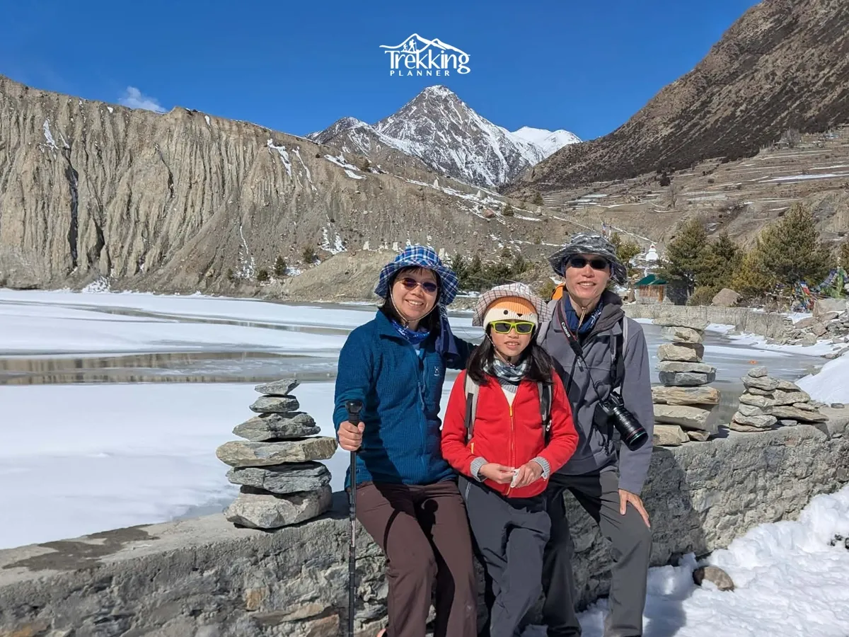 Trekkers enjoying the frozen Tilicho Lake on the Annapurna Circuit Trek with Tilicho Lake and ABC Trek.