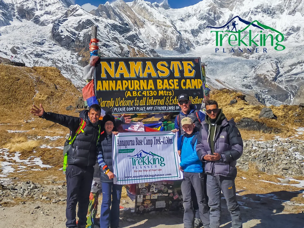 Family hiking together on scenic Himalayan paths surrounded by lush greenery in Annapurna