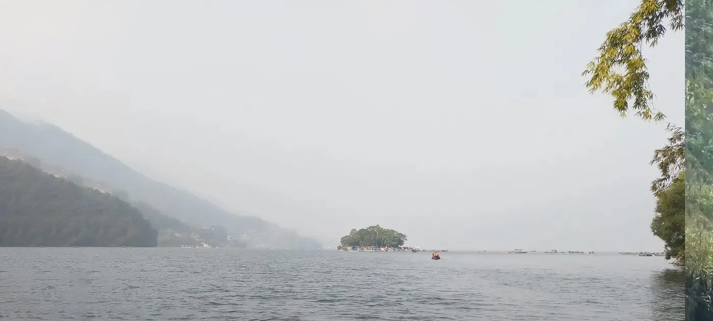 Family enjoying scenic beauty of Phewa lake in pokhara