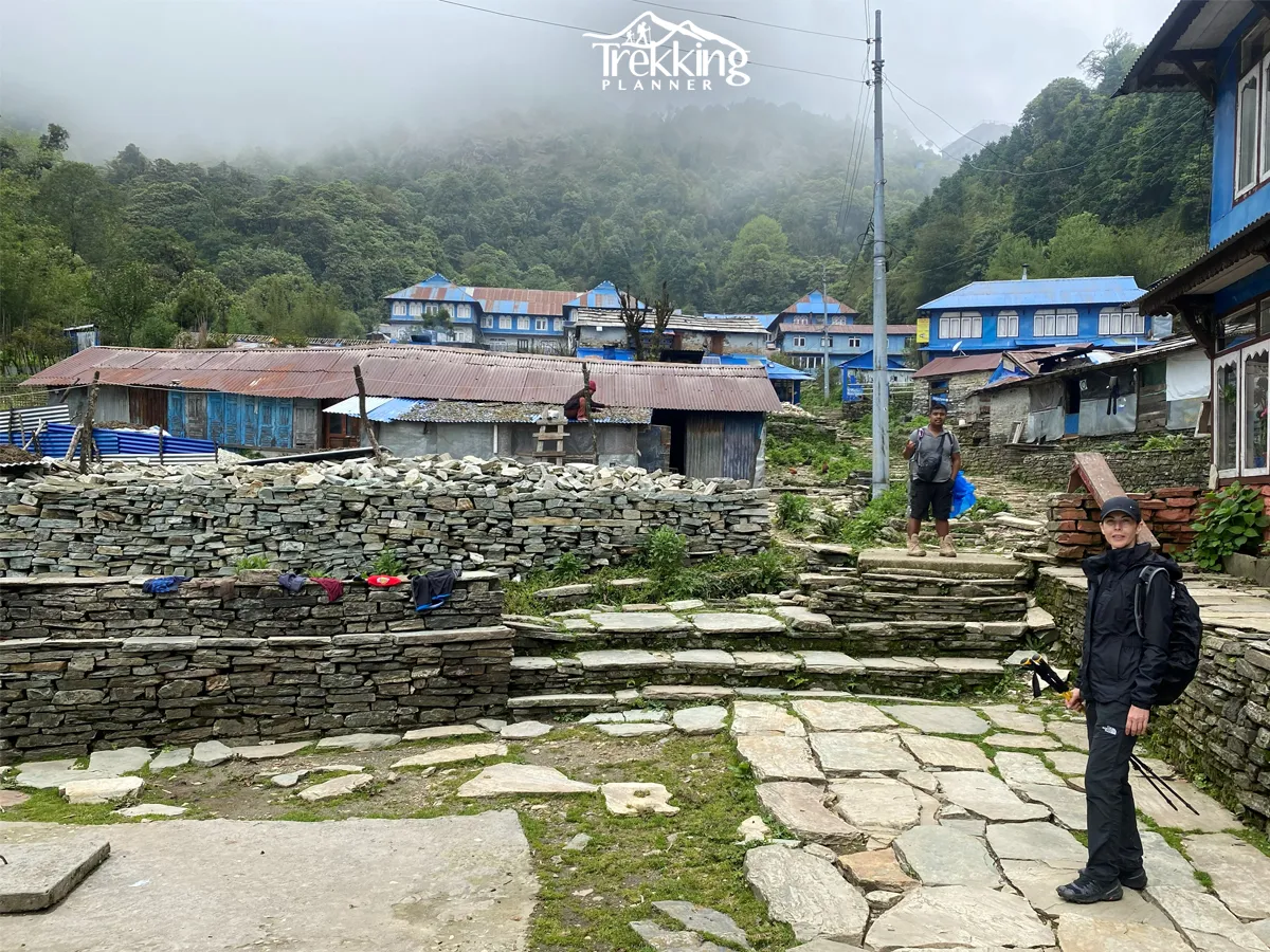 Stone-paved streets and traditional Gurung houses in Ghandruk Village during the Annapurna Panorama Trekking adventure.