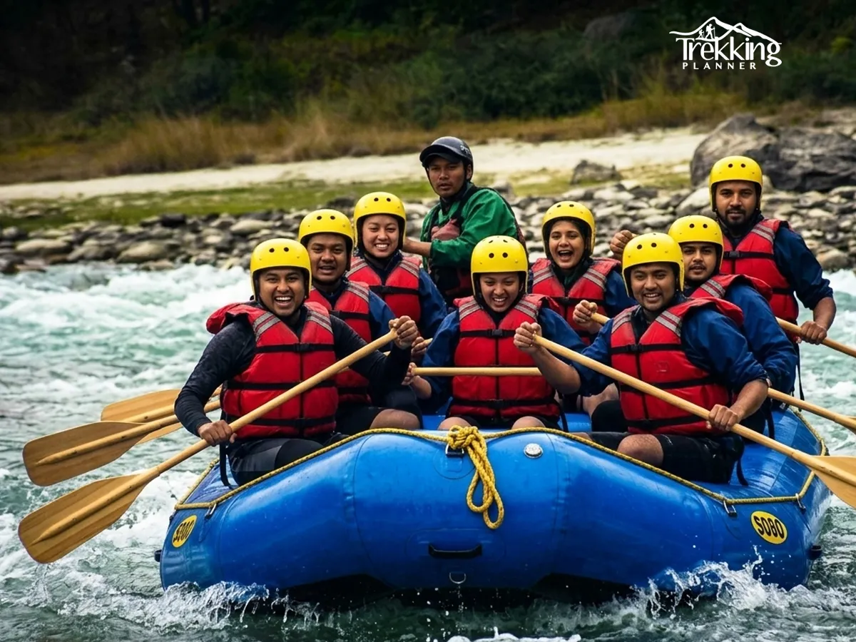 Group of tourists enjoying rafting together on Bhote Koshi River surrounded by Himalayan landscape