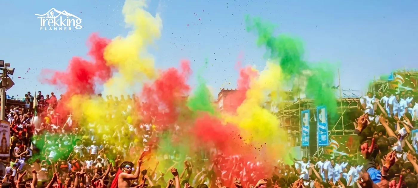 People celebrating Holi festival in Nepal throwing colorful powders and water