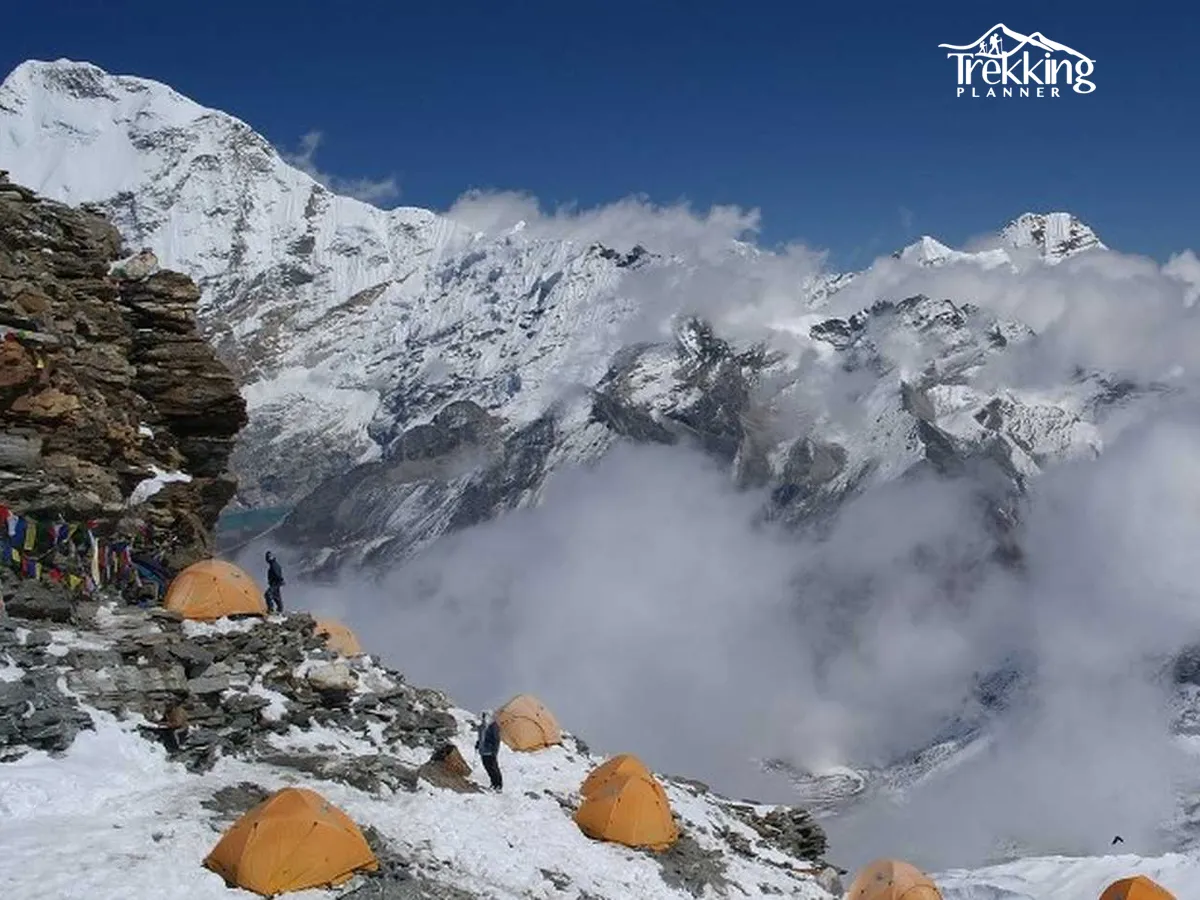 Ice climber ascending a frozen waterfall during an ice climbing adventure in Nepal.