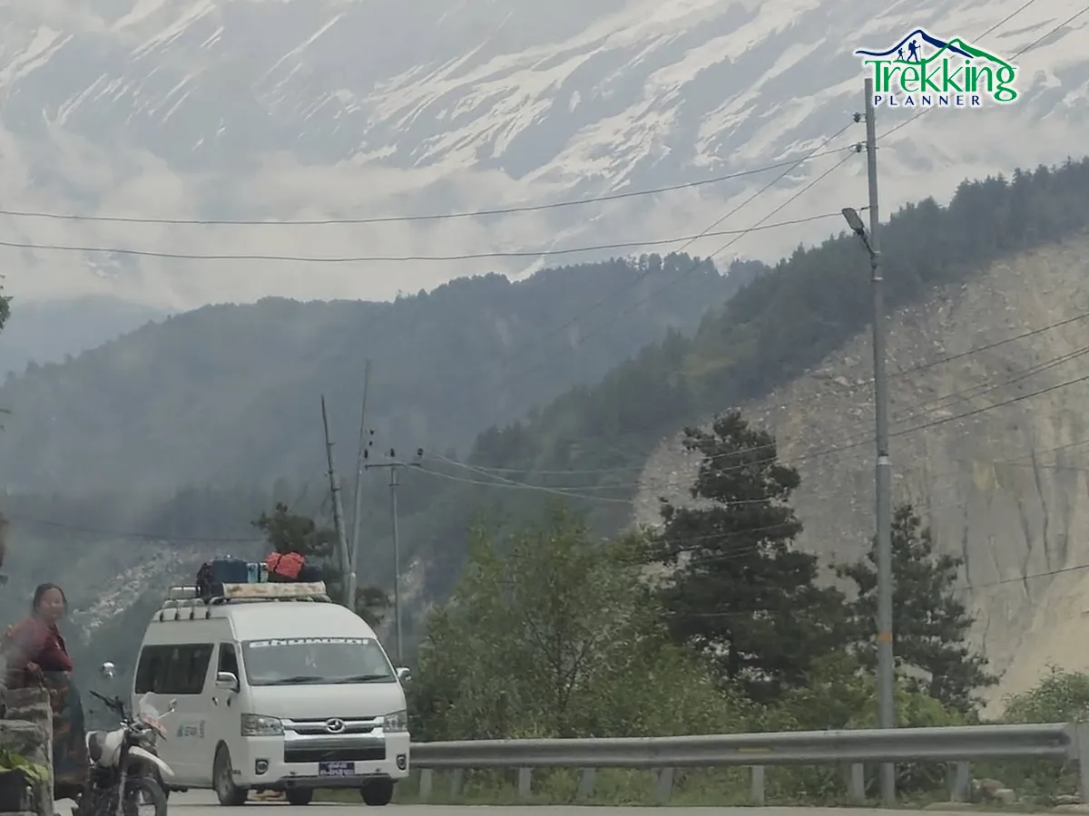 Jeep driving on off-road mountain highway during Muktinath Temple tour in Nepal