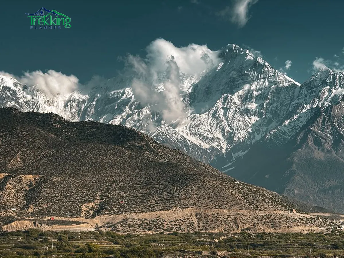 Jomsom village landscape surrounded by dry Himalayan mountains on trekking route to Muktinath