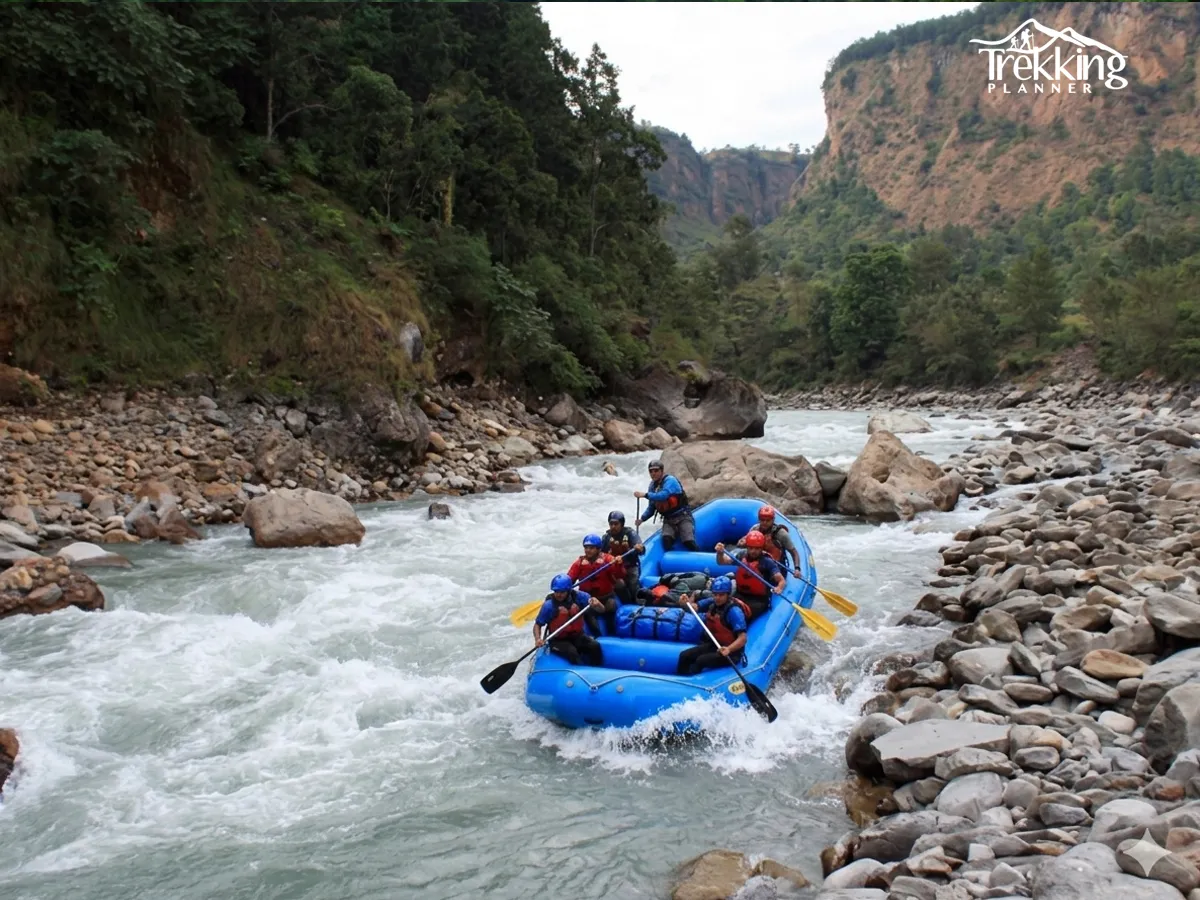 Group of tourists enjoying white water rafting adventure in the Kali Gandaki River with strong rapids