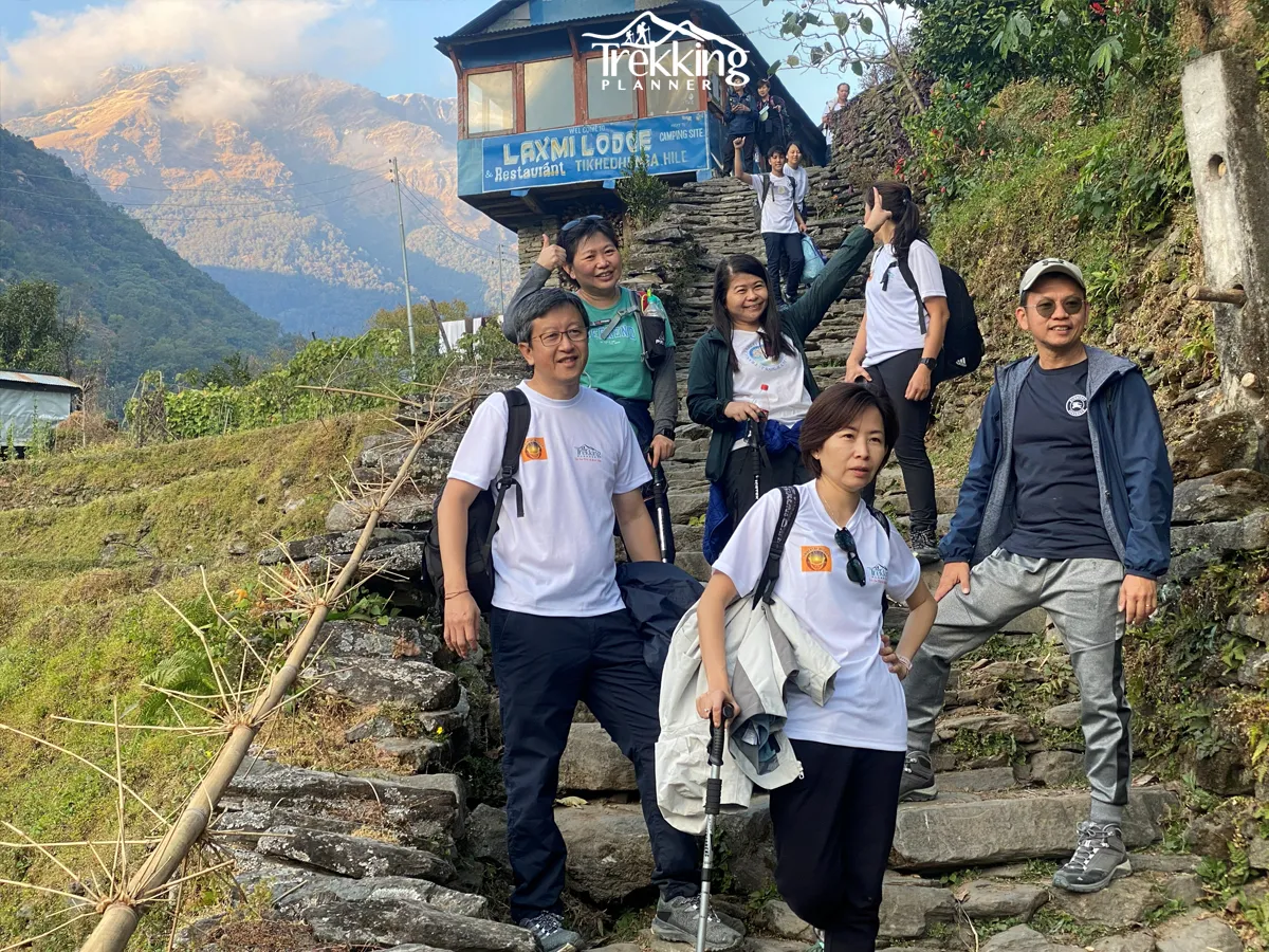 Trekkers walking on a traditional stone trail during Khopra Poon Hill Trekking