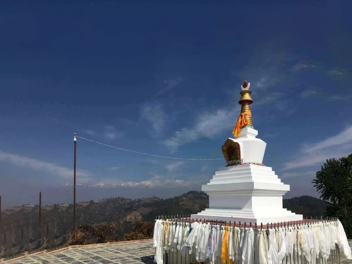 Buddhist prayer flags at Namobuddha Monastery with peaceful surroundings