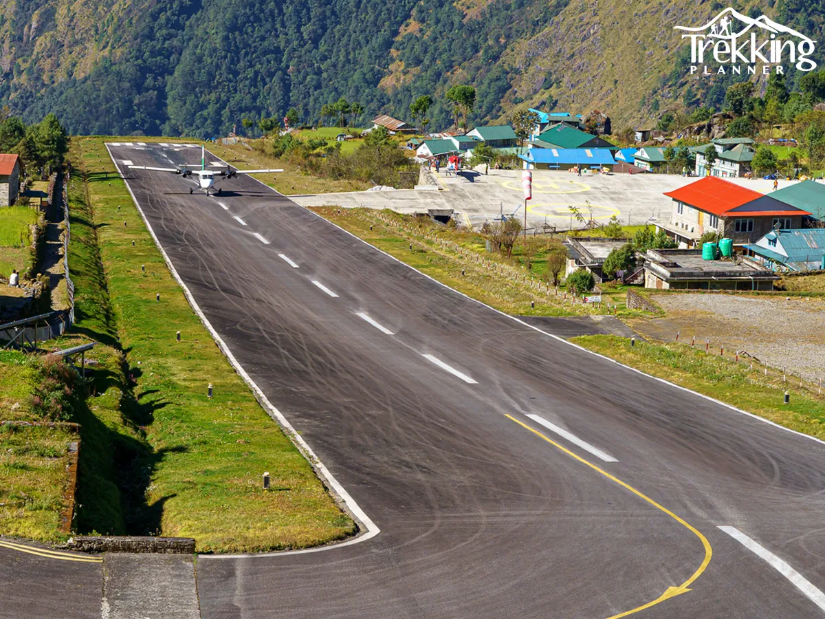 Domestic aircraft flying in Nepal mountains showing Kathmandu to Lukla flight price update and booking information