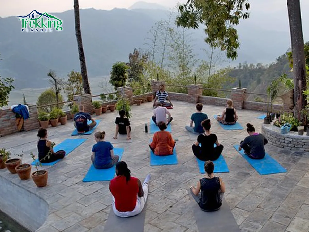 Meditation tour in Nepal with yoga and meditation practice at sunrise overlooking Himalayan landscape