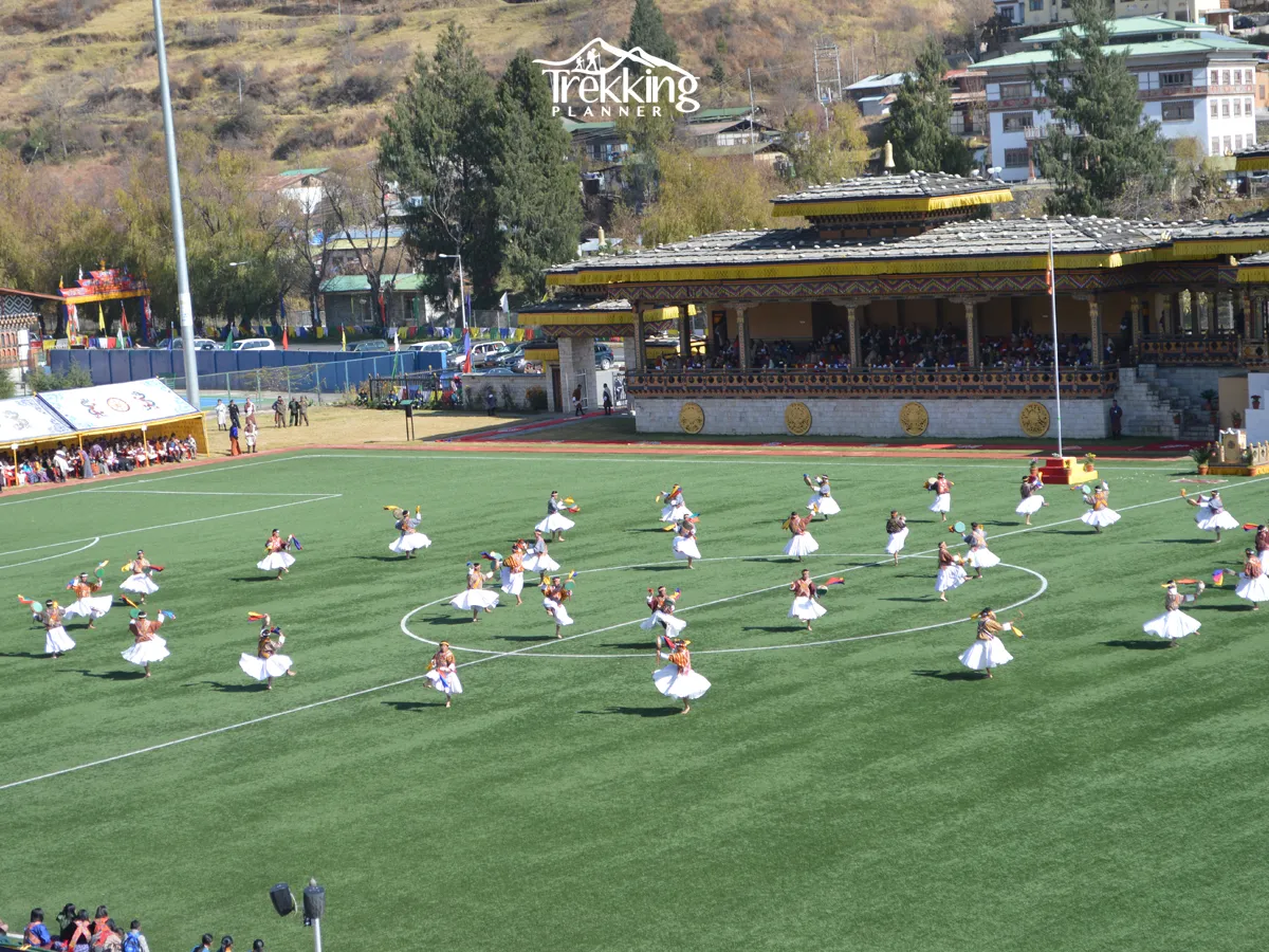 Traditional dancers performing sacred dances during the Paro Tshechu Festival in Bhutan.