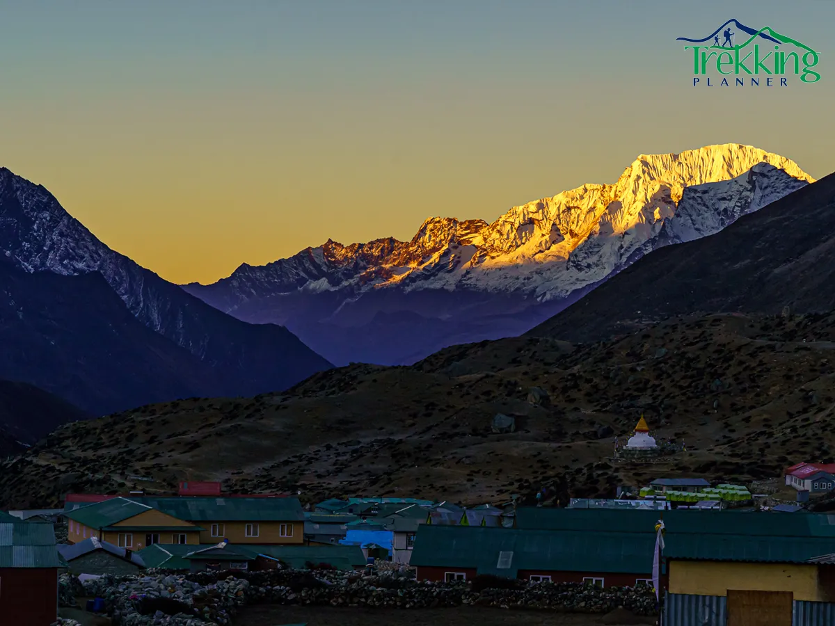 Group of climbers celebrating on Pokalde Peak summit in the Everest region of Nepal