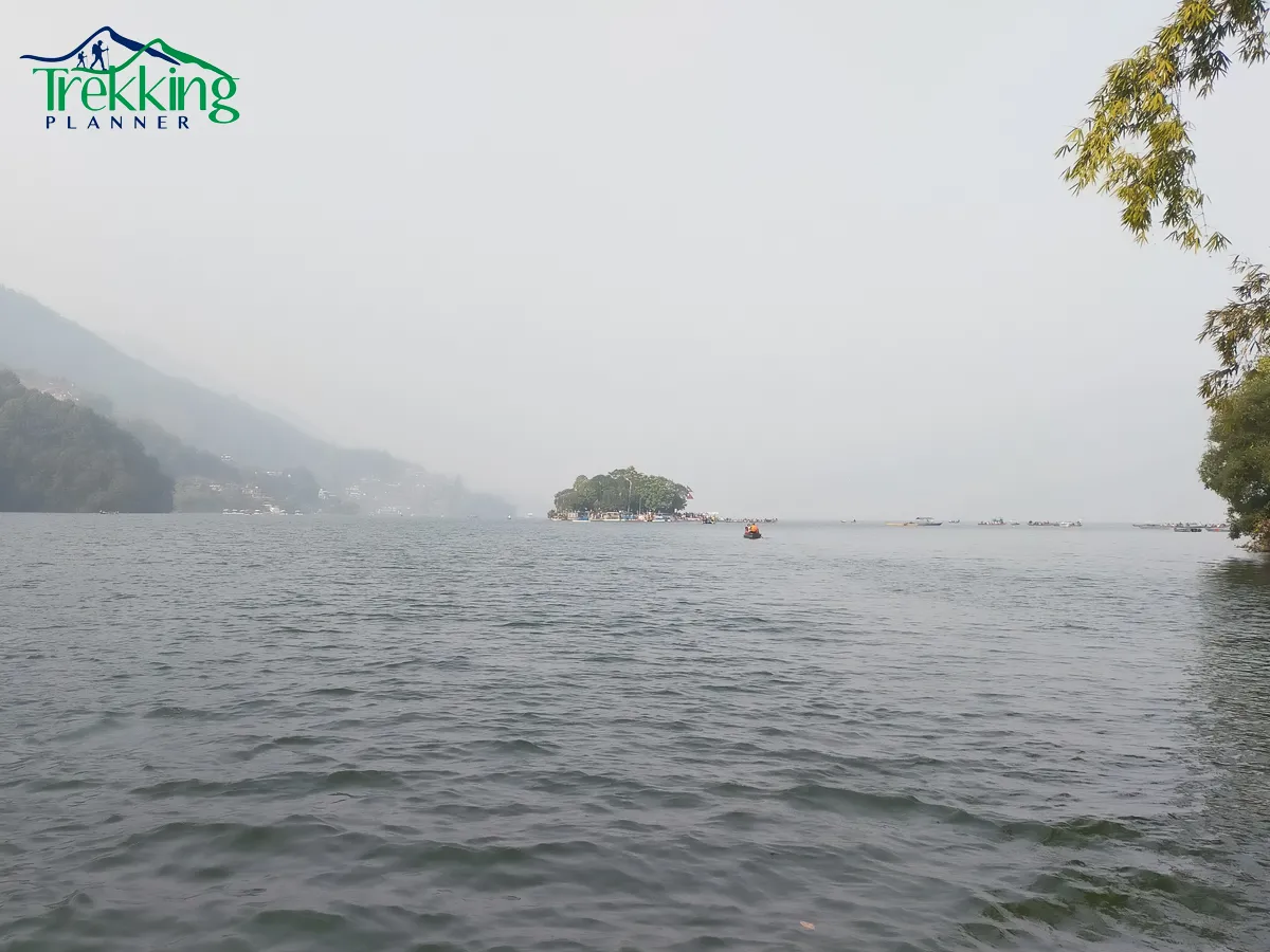 Scenic Phewa Lake with colorful boats and Annapurna views in Pokhara Nepal
