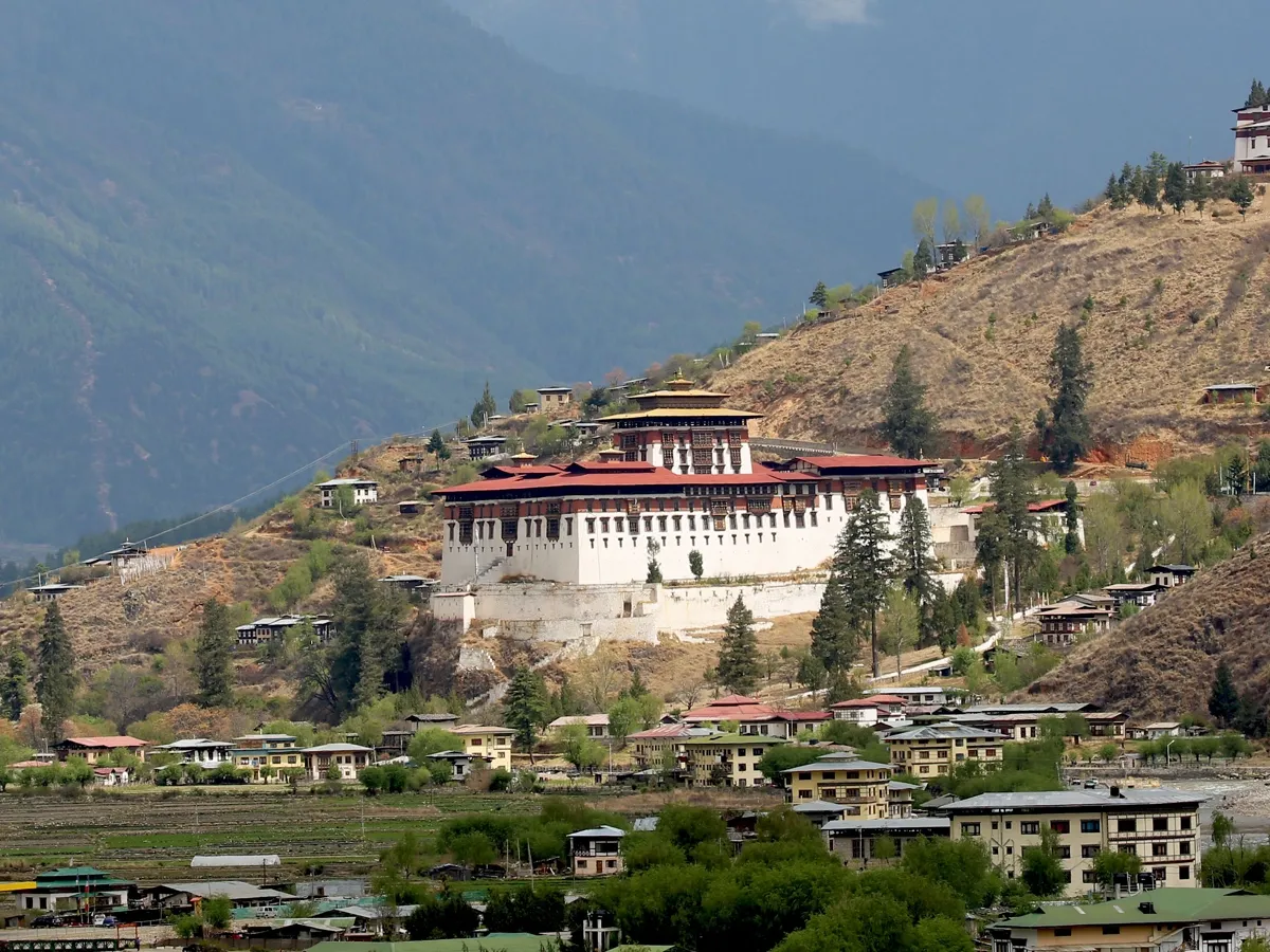 Panoramic view of Punakha Dzong surrounded by valleys during a Bhutan Tour.