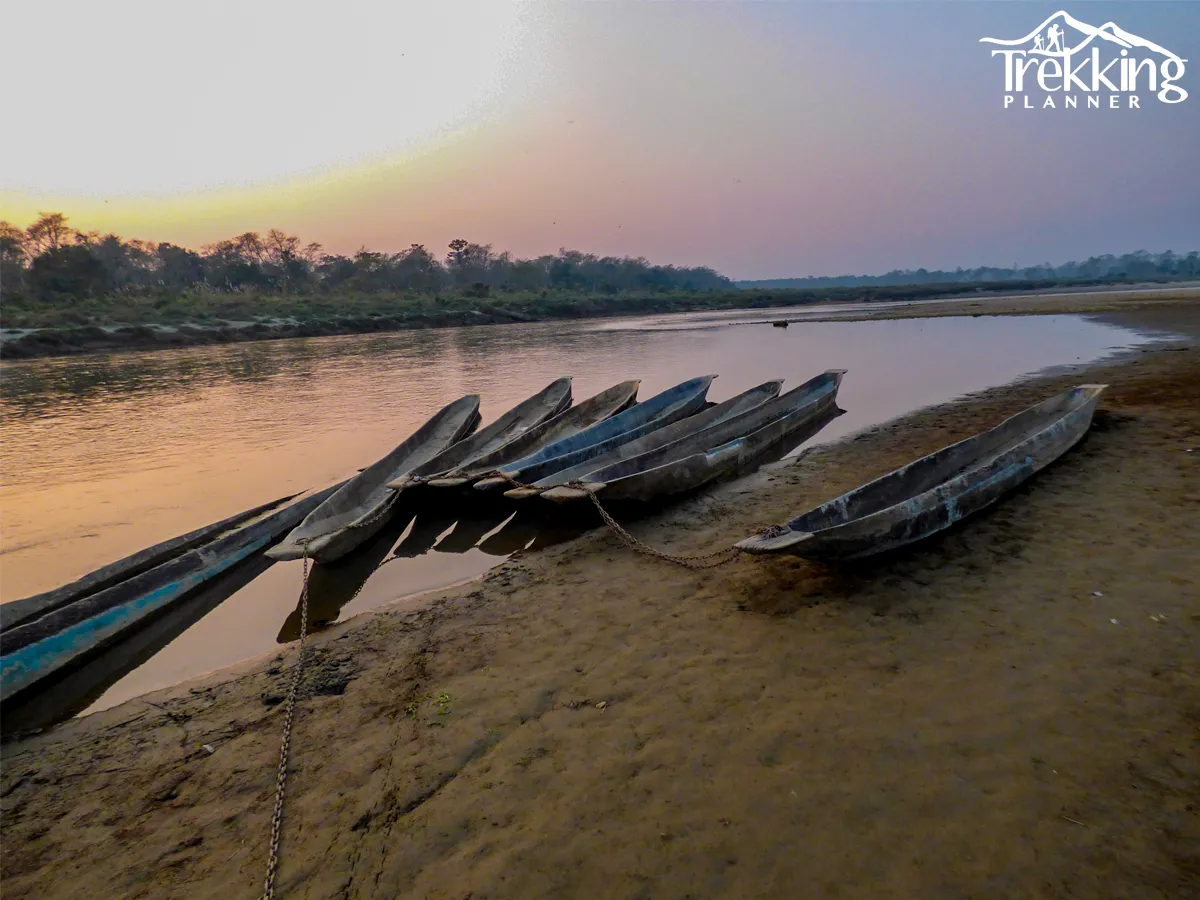 Canoe ride on Rapti River in Chitwan National Park with crocodiles view