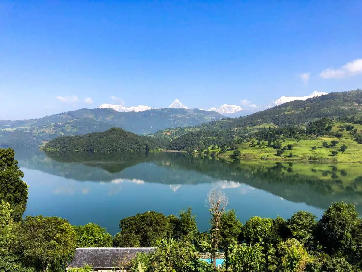 Hikers enjoying the Royal Trek near Pokhara with lush hills and Himalayan landscapes