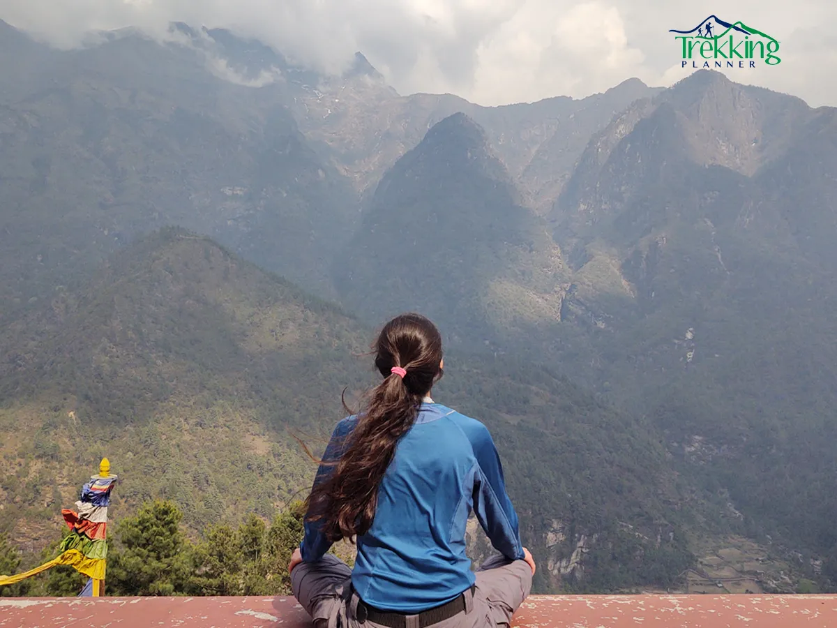 Yoga practitioners in silence performing yoga poses during sunrise with Himalayan backdrop in Nepal