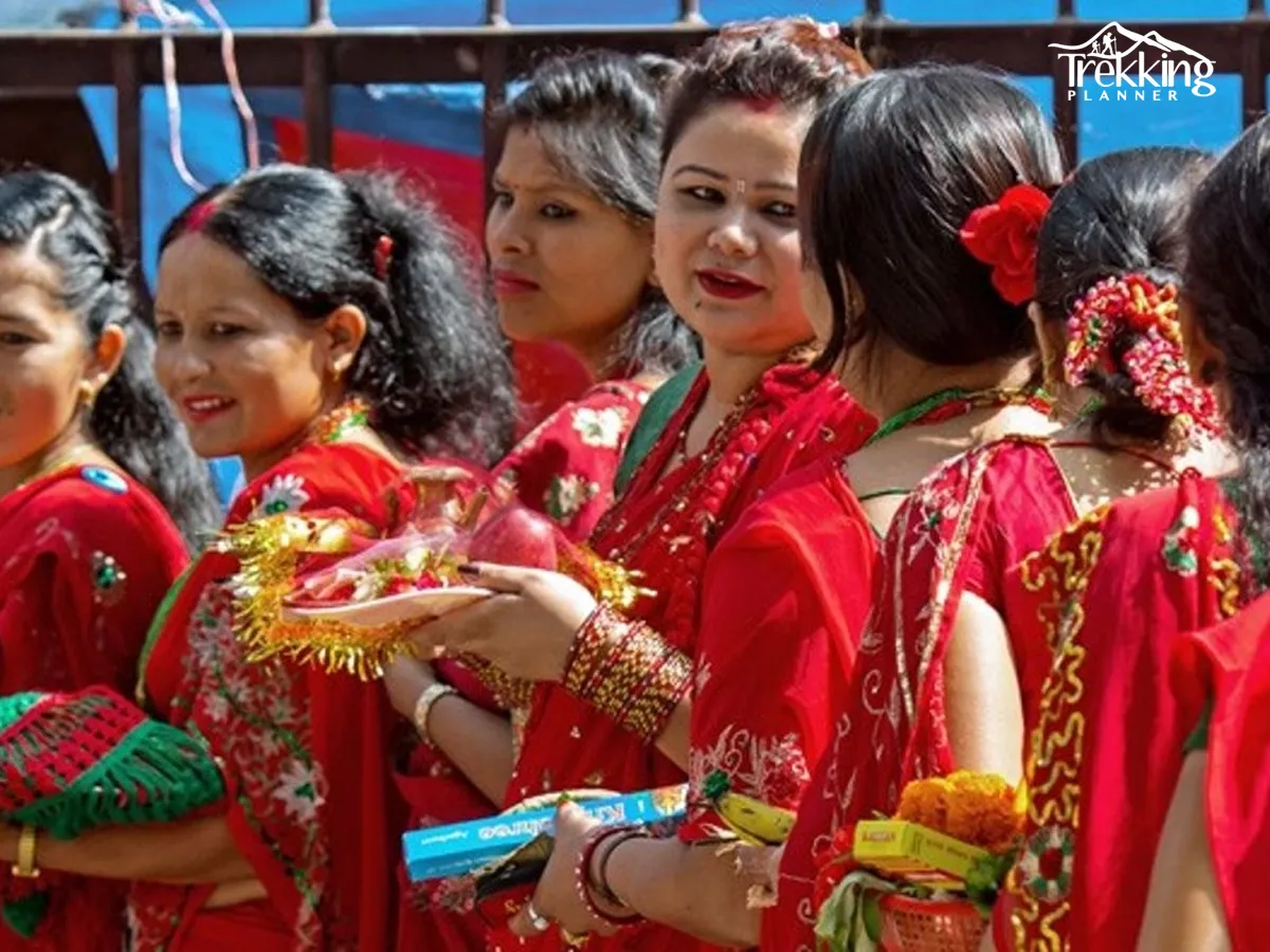 Women applying mehendi during Teej festival celebrations in Nepal