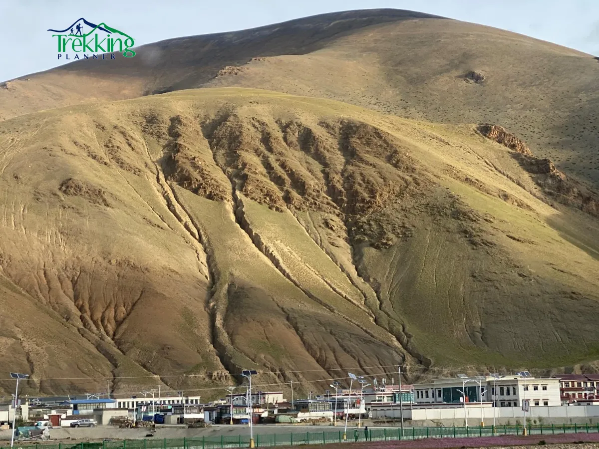 Vehicle traveling on the Friendship Highway during Tibet Overland Tour