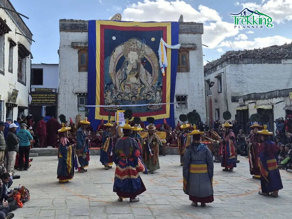 Buddhist monastery in Upper Mustang with prayer flags and mountain backdrop