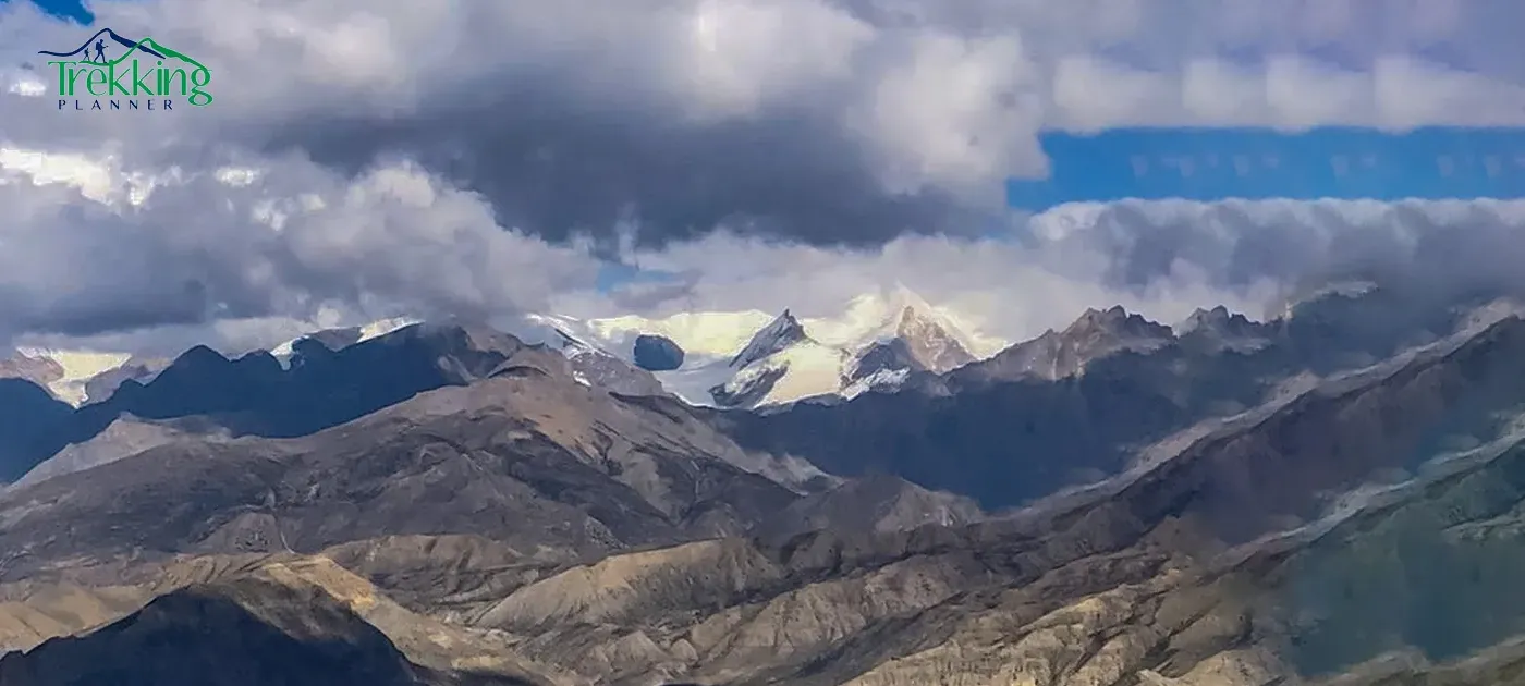 Upper Mustang trekking trail with Himalayan desert landscape and mountains in Nepal