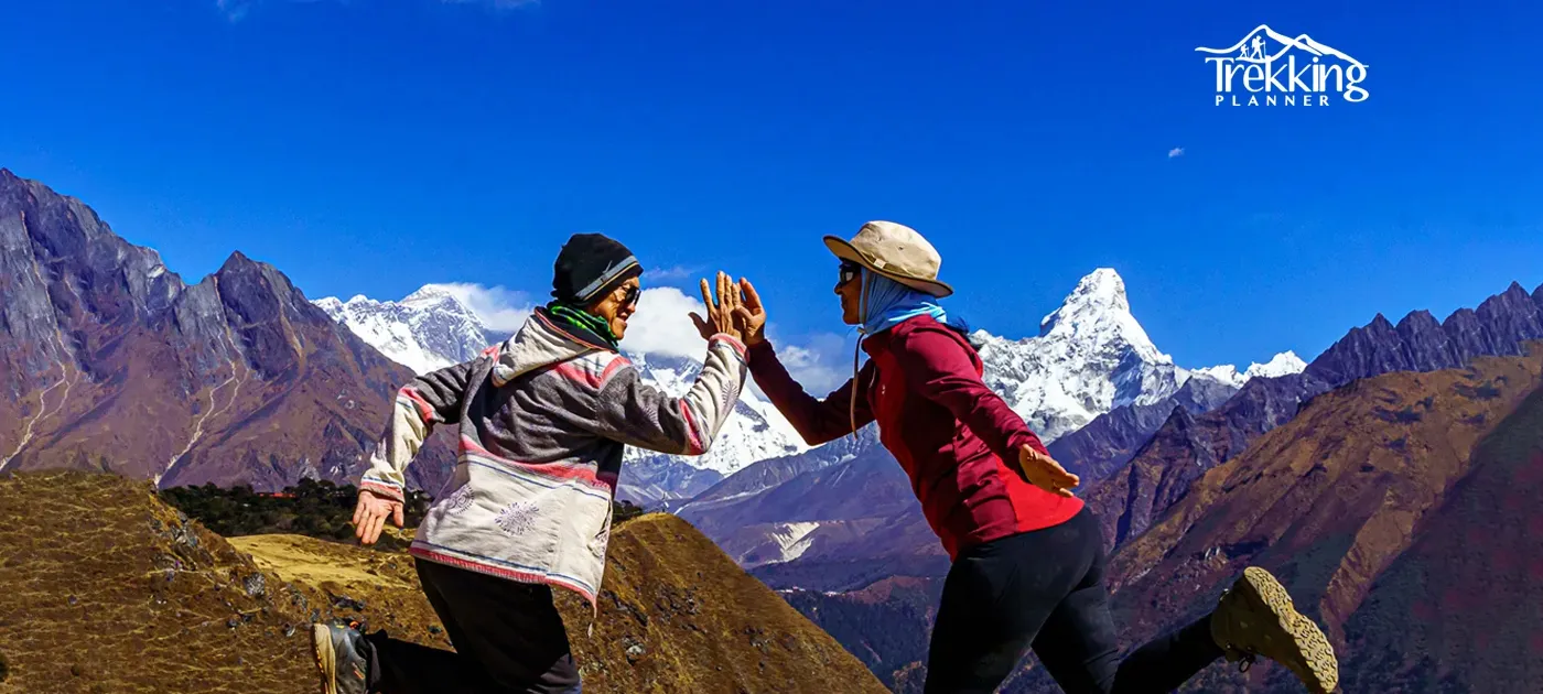 Yoga session at sunrise in the Himalayas of Nepal with mountain backdrop