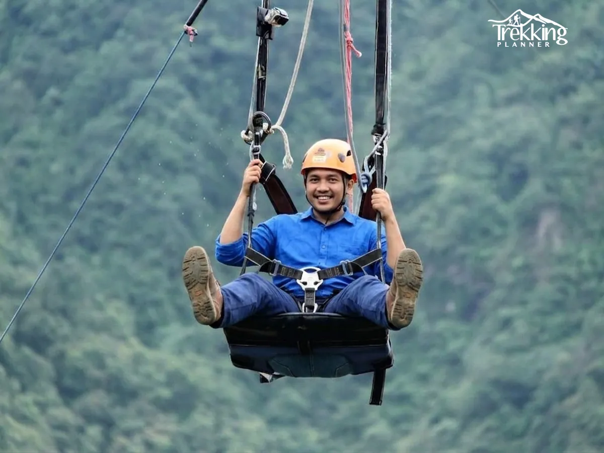 Zip line adventure in Nepal with Himalayan mountain views and clear blue sky