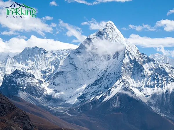 Ama Dablam expedition climbers approaching the snowy summit ridge during ascent