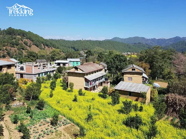 Scenic view of terraced hills and traditional houses during Balthali Village Trek in Nepal