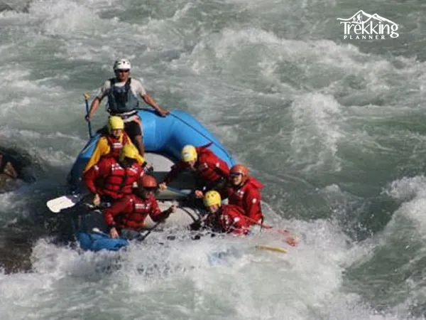 Rafters navigating intense white water rapids on Bhote Koshi River during an extreme rafting adventure