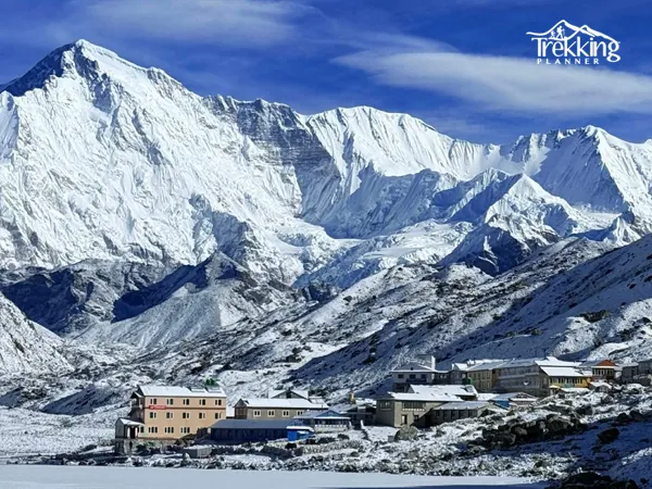 Trekkers crossing the snowy Cho La Pass at 5,420 meters on the Gokyo Cho La Pass Trek via Everest Base Camp.