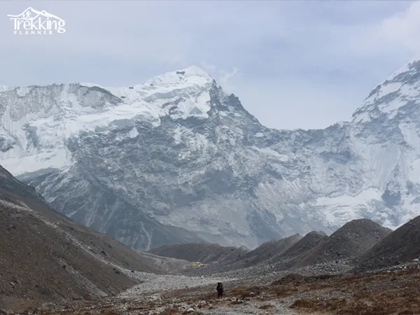 Senior trekkers enjoying the Everest Base Camp trekking trail with Himalayan mountain views in Nepal.