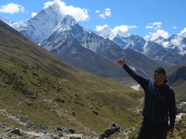 Travelers driving to Everest Base Camp by road through the Himalayan mountain landscape of Nepal.