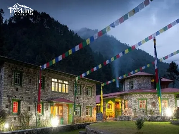Trekkers walking along Everest Luxury Lodge Trekking trail surrounded by Himalayan landscapes