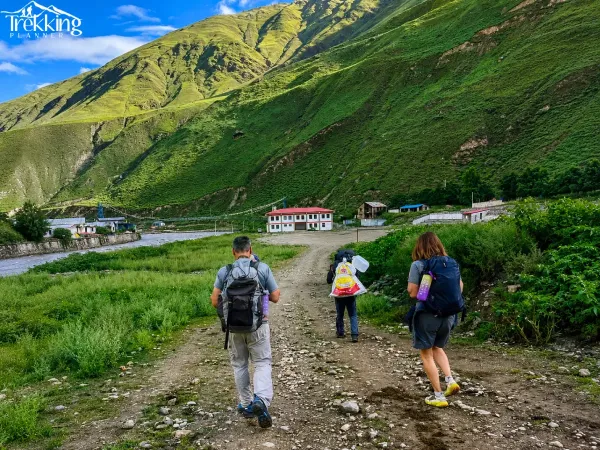 Hikers Journey Through A Scenic Valley