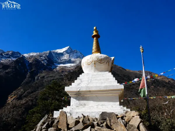 Himalayan Stupa Surrounded By Snow Capped Mountains