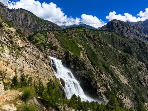 Majestic Waterfall In Rocky Mountain Canyon